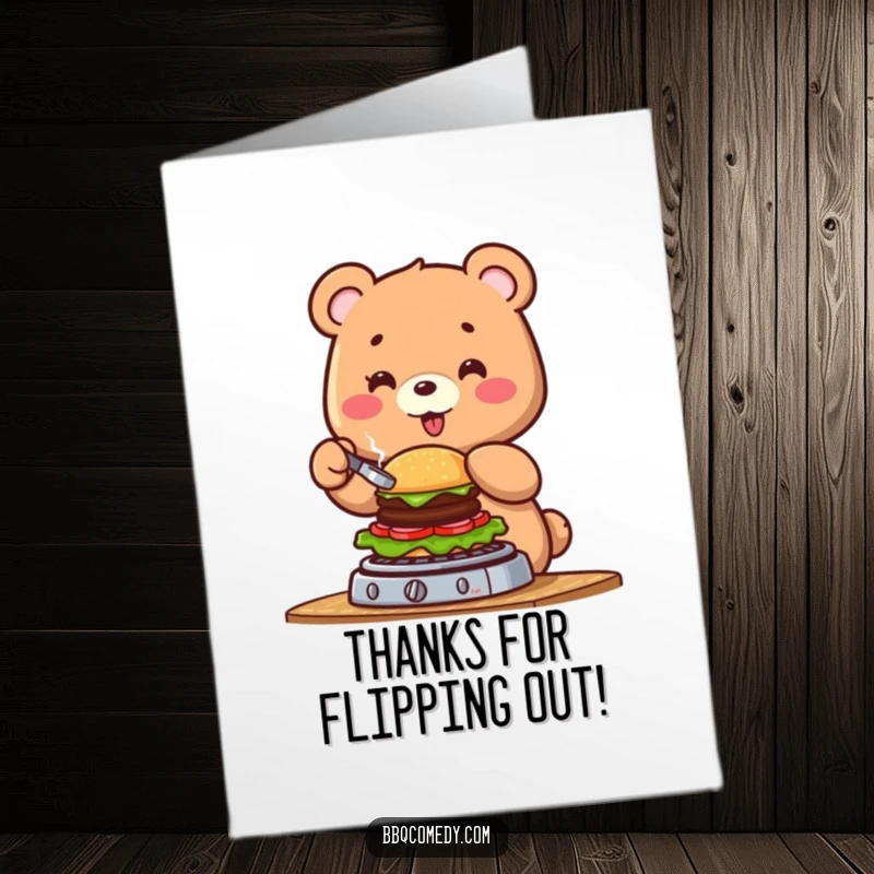 Funny free printable thank you card: a bear character joyfully flipping a miniature burger on a grill, conveying thanks.